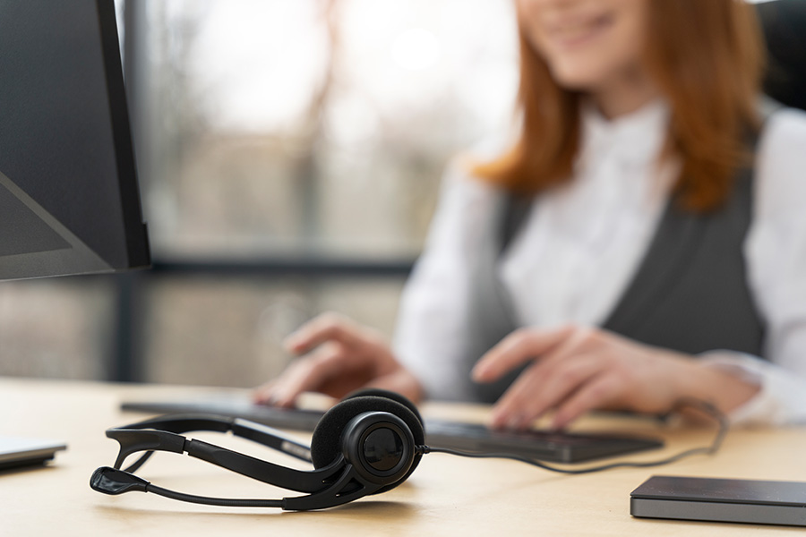 Answering service agent at desk
